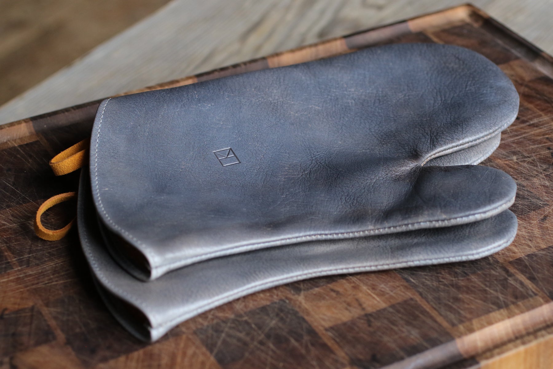 Grey leather oven mitts by LK