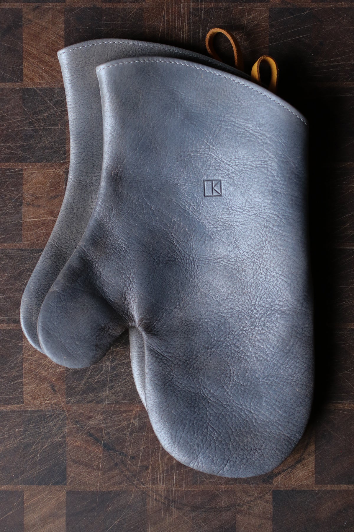 Grey leather oven mitts by LK