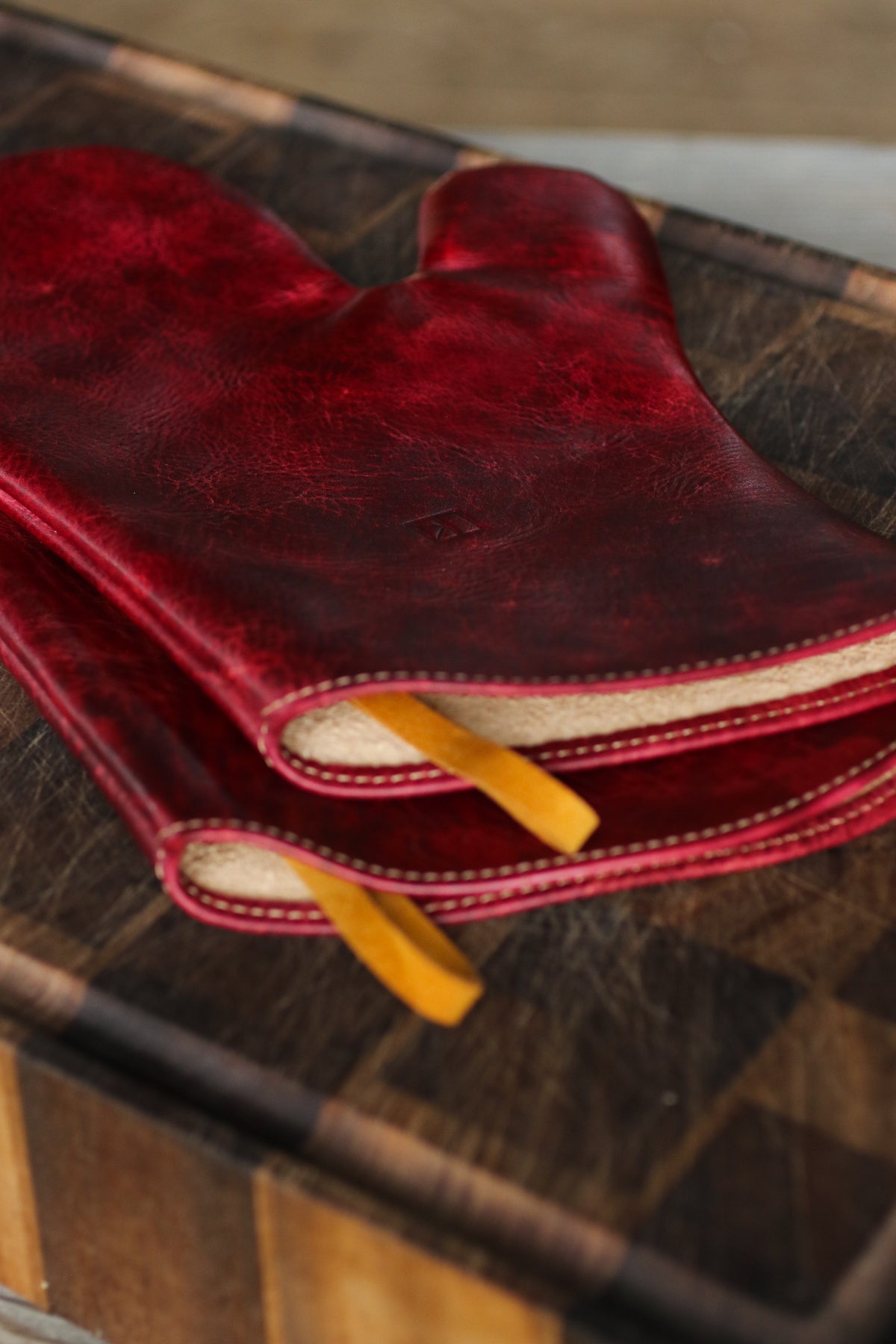 maroon leather oven mitts