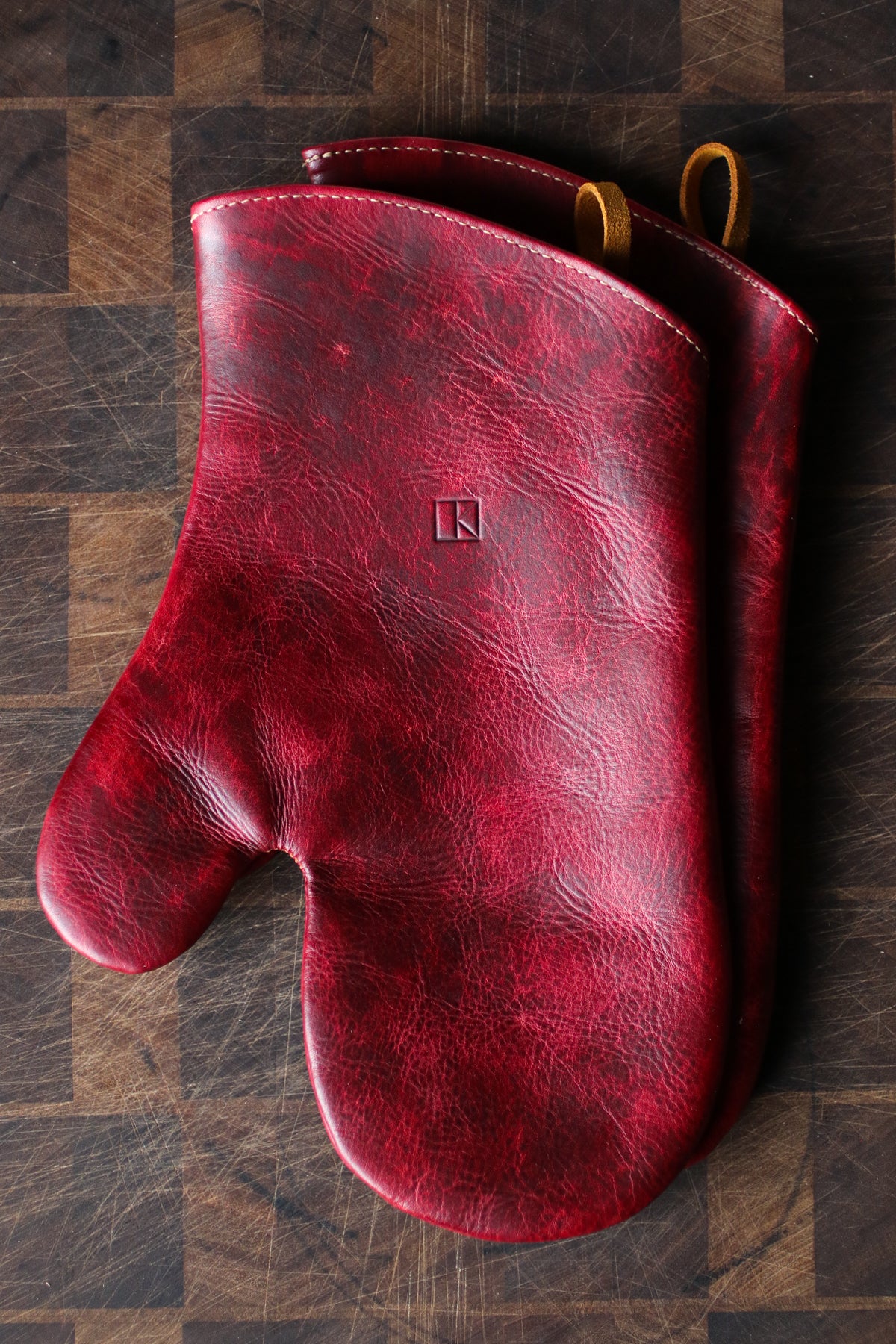 maroon leather oven mitts