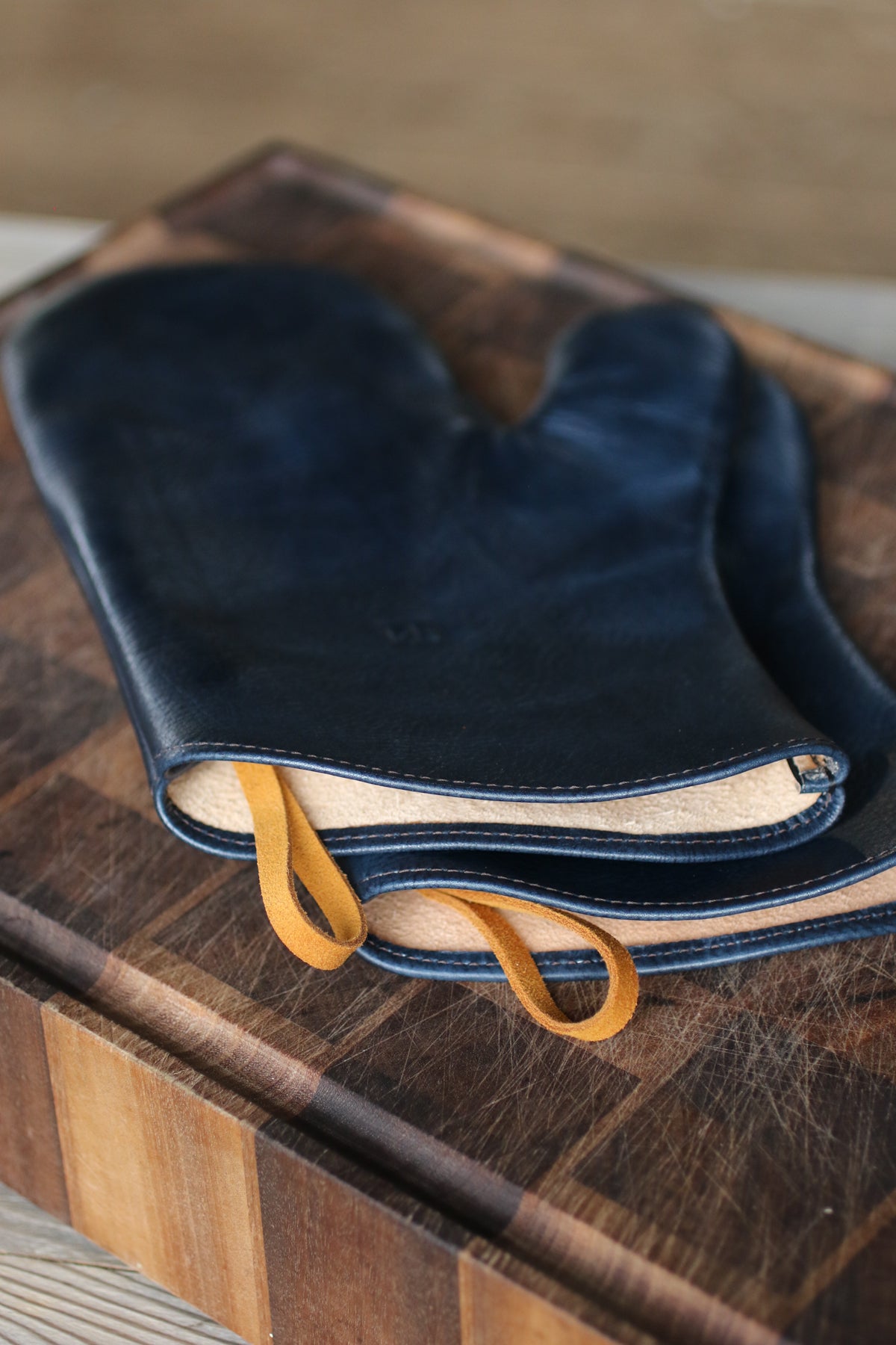 dark blue leather oven mitts