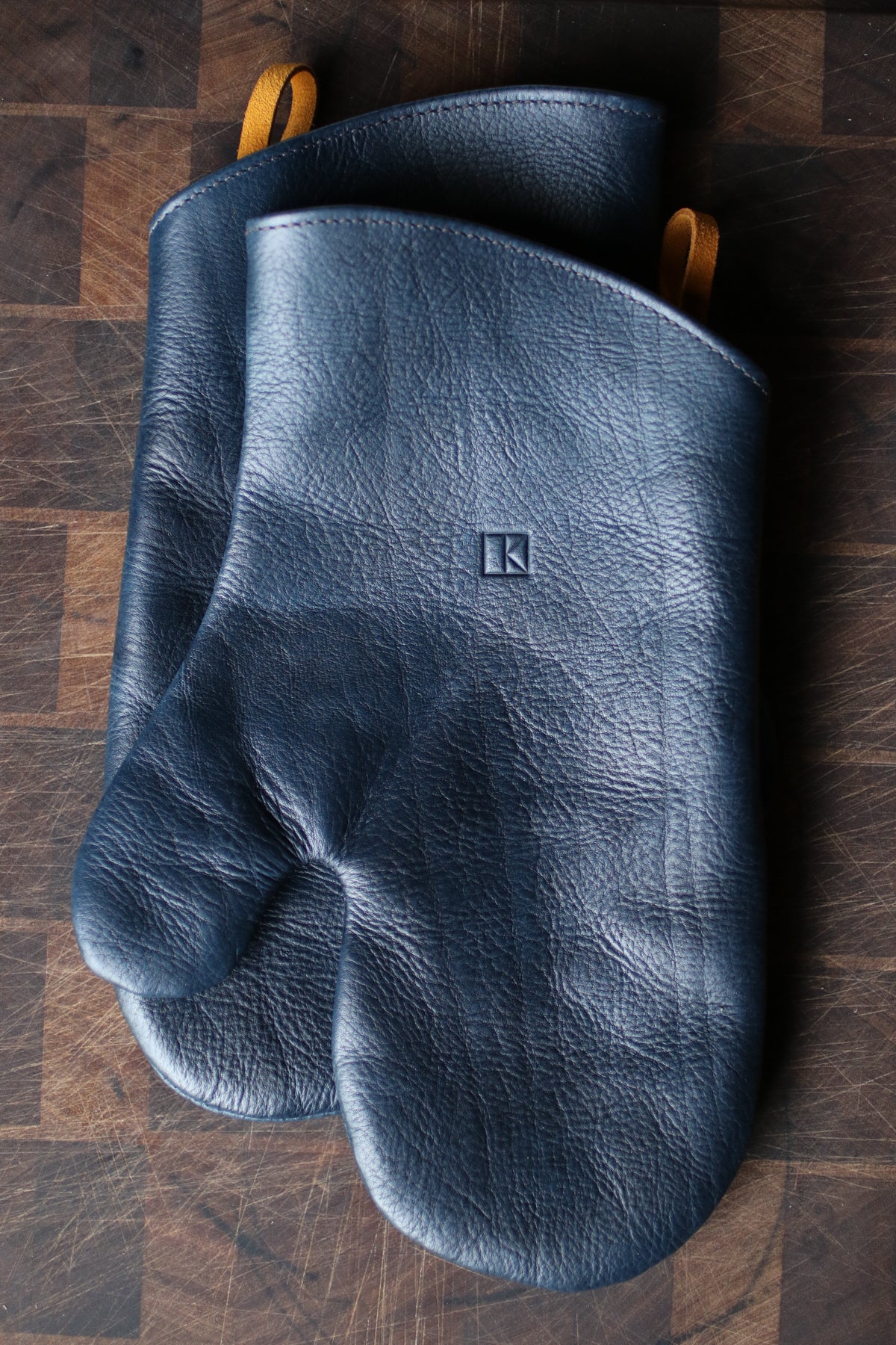dark blue leather oven mitts