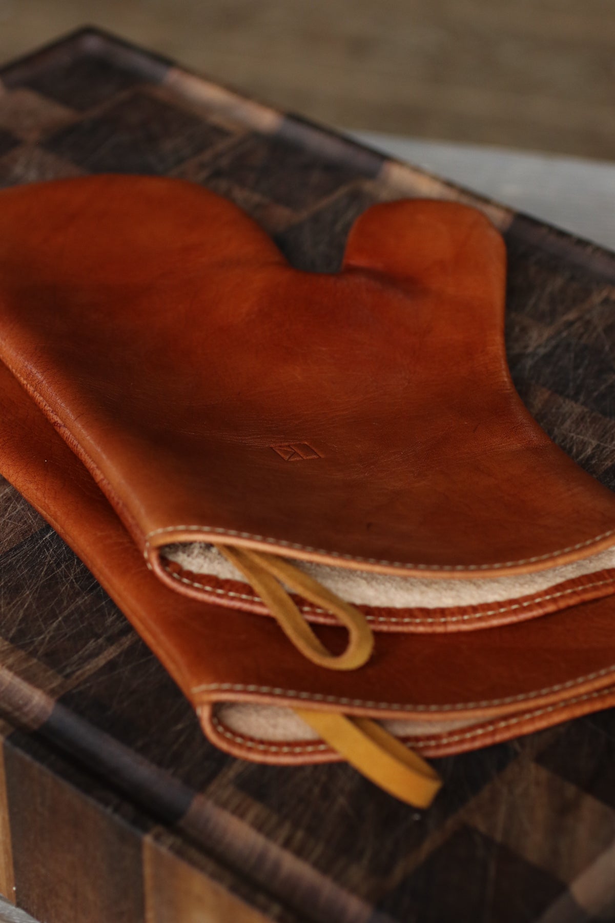 Brown leather oven mitts by LK