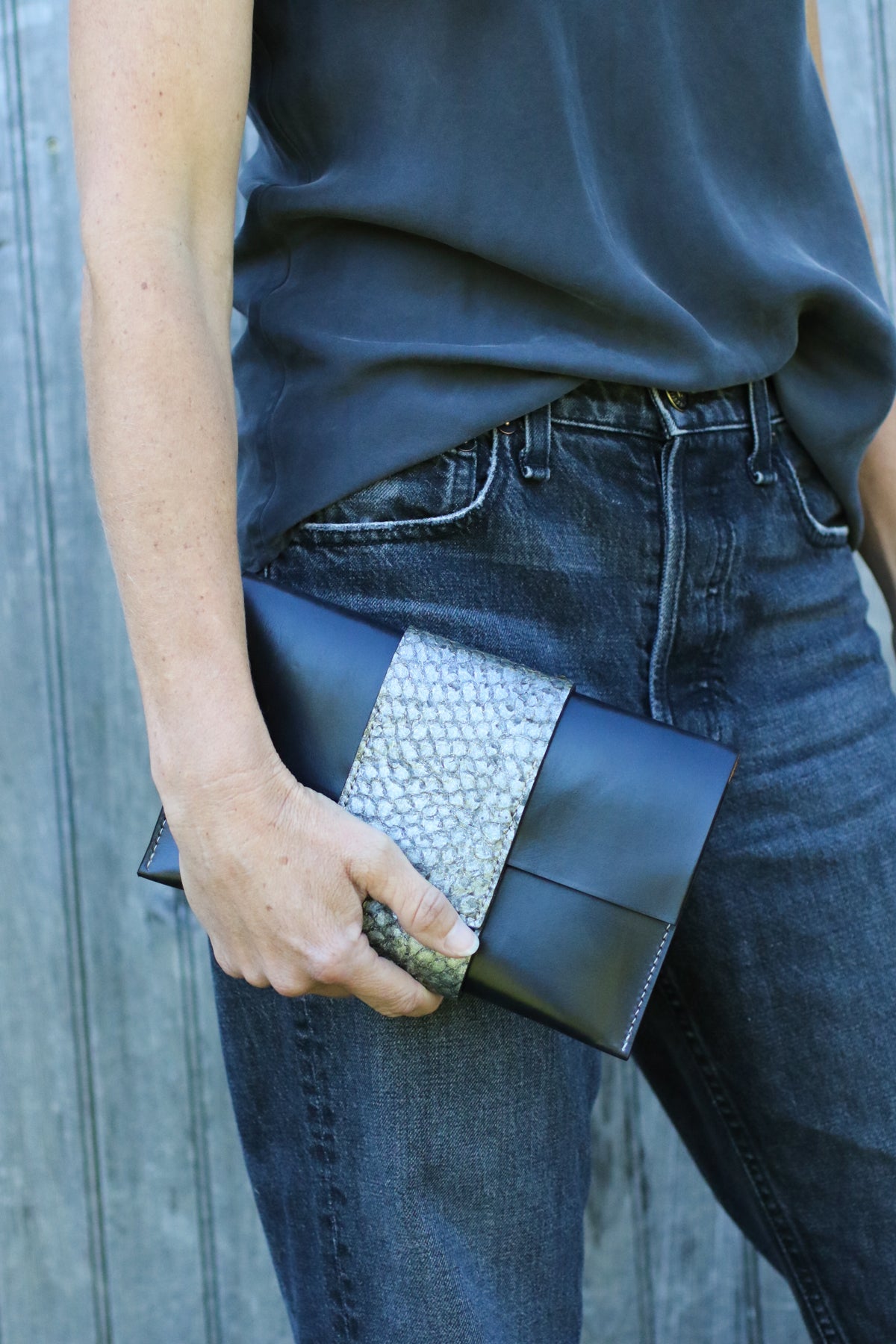 black leather perch clutch