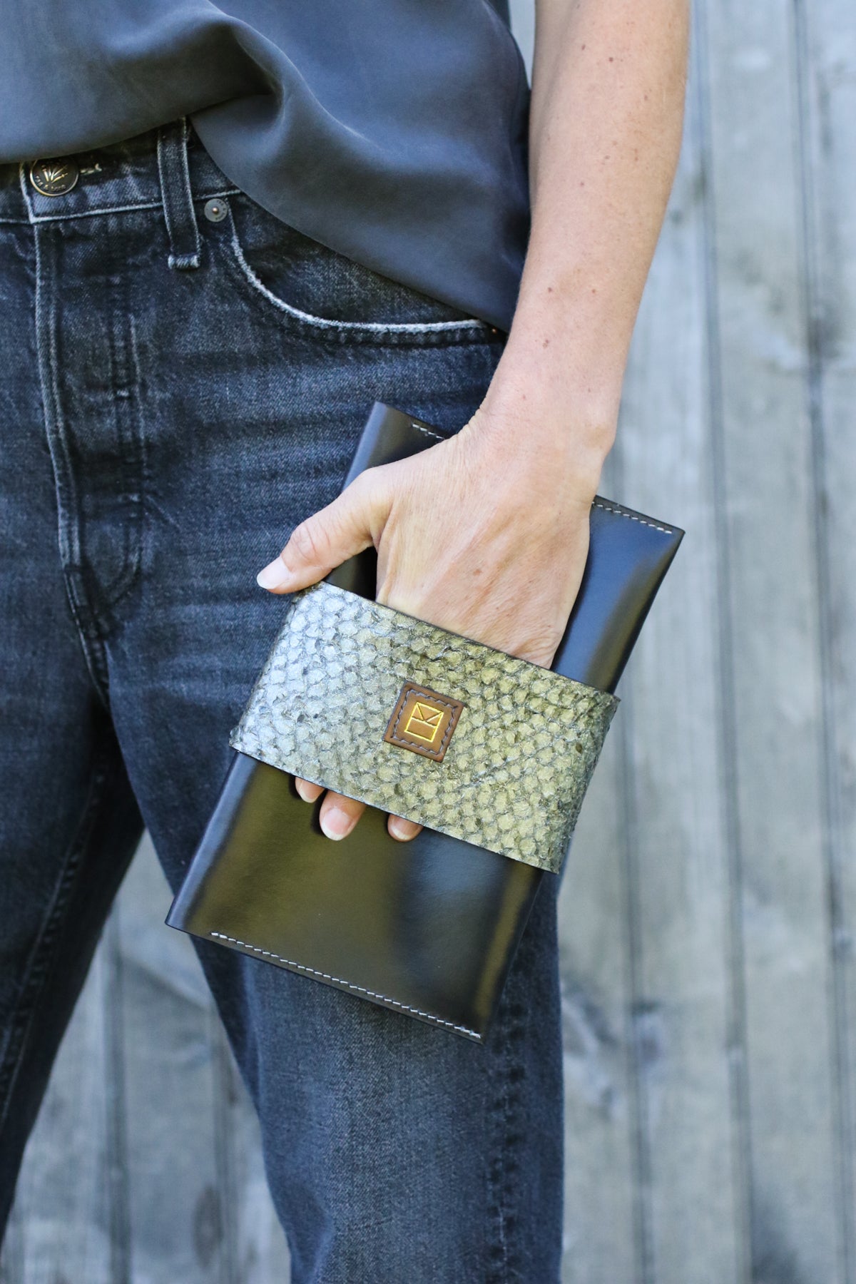 black leather perch clutch