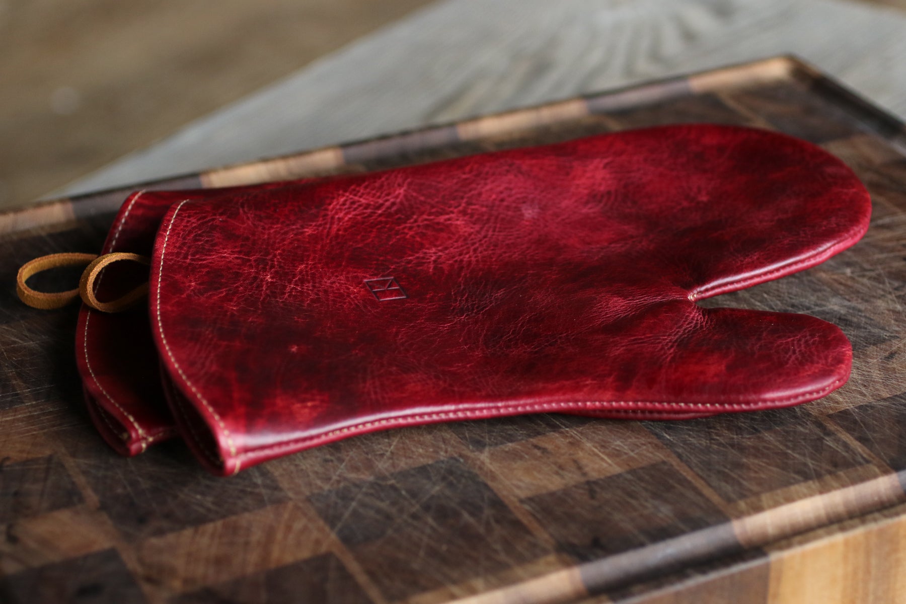 maroon leather oven mitts
