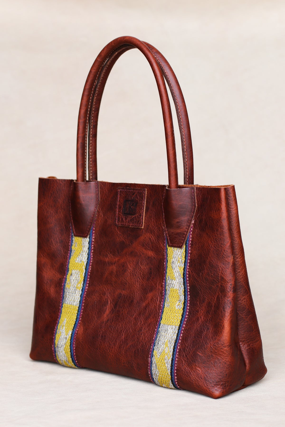 Peruvian textile bison leather tote