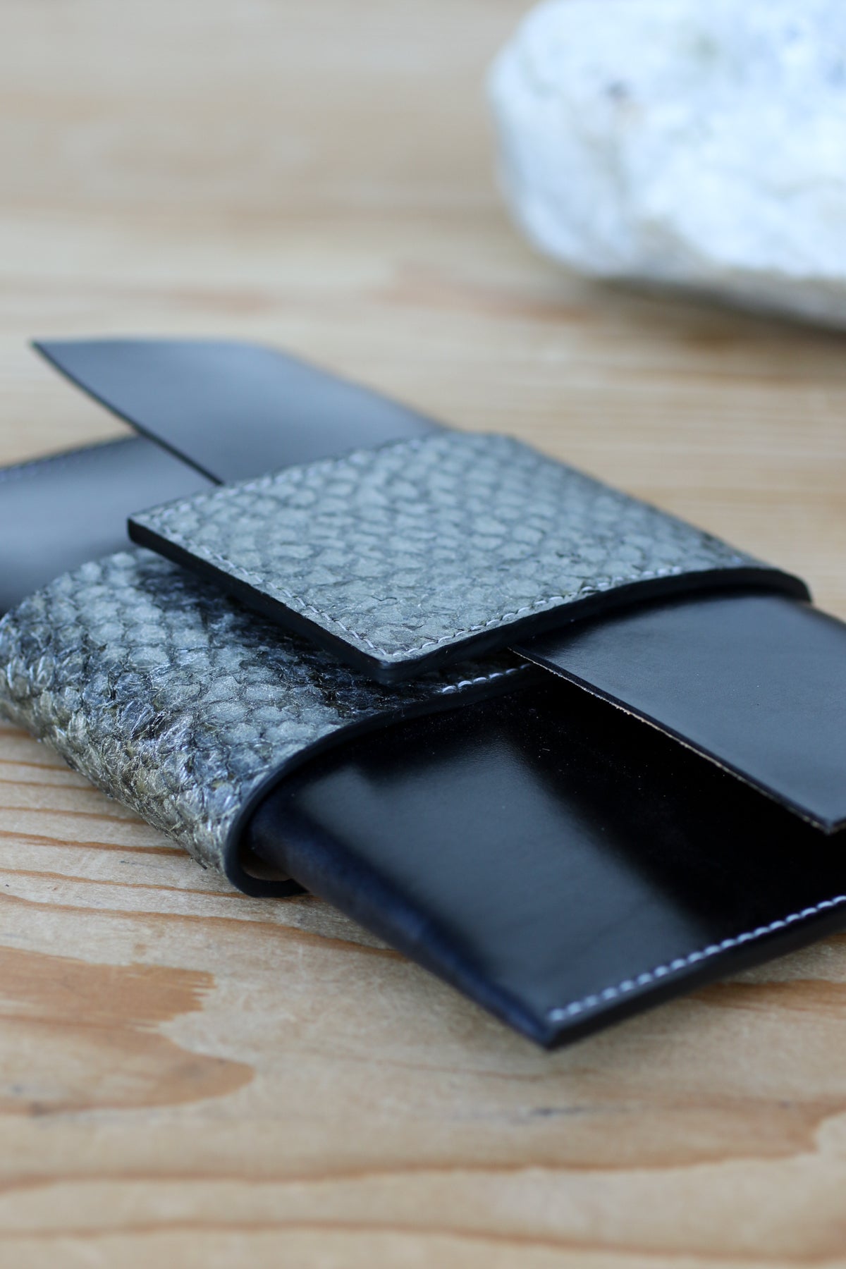 black leather and fish skin clutch