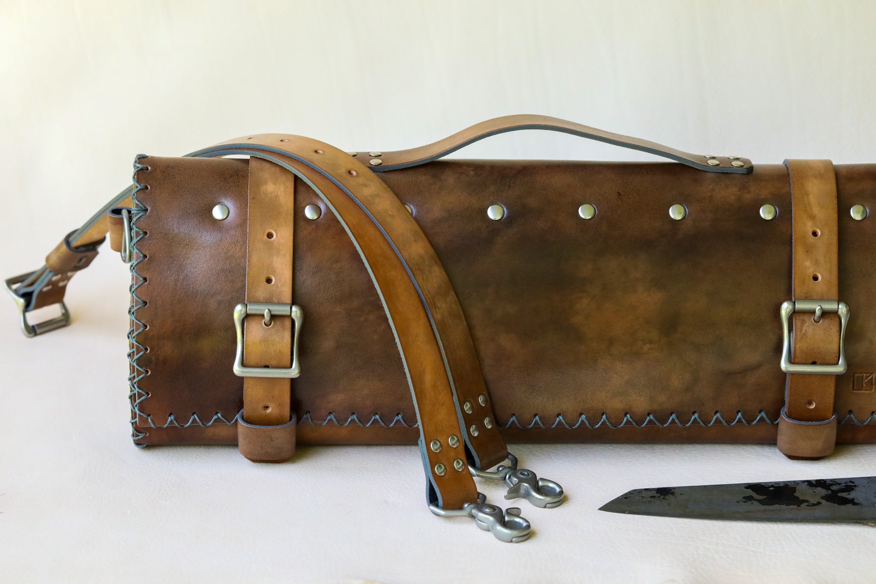 Italian leather knife roll with olive green interior